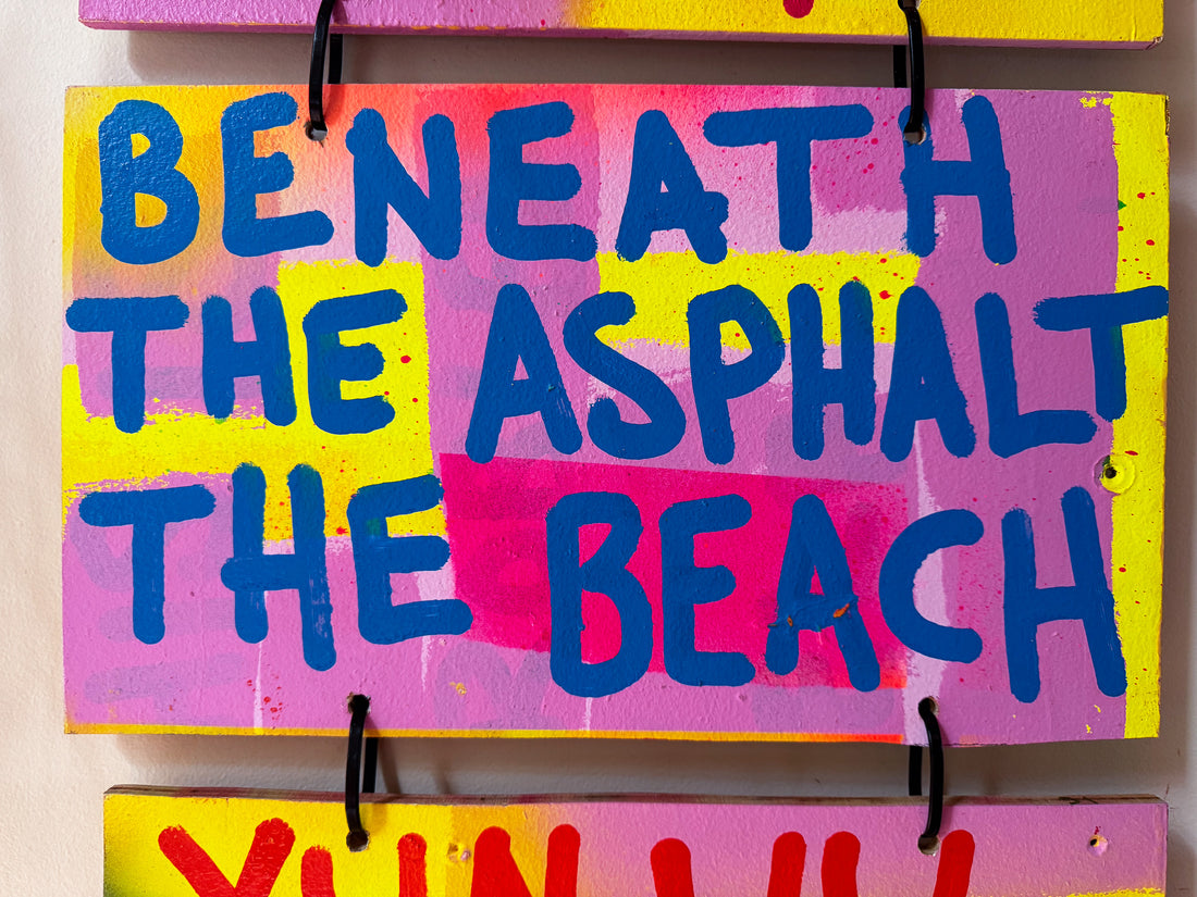 Beneath the asphalt the beach